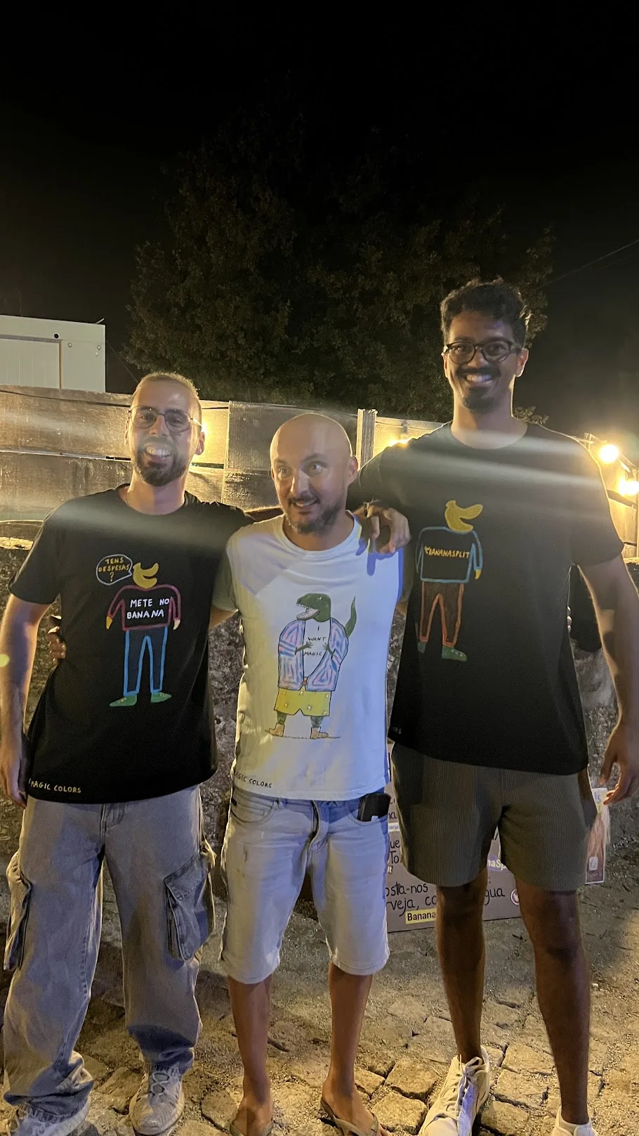 The two BananaSplit t-shirts next to another The Magic Colors creation, in a group photo at the festival