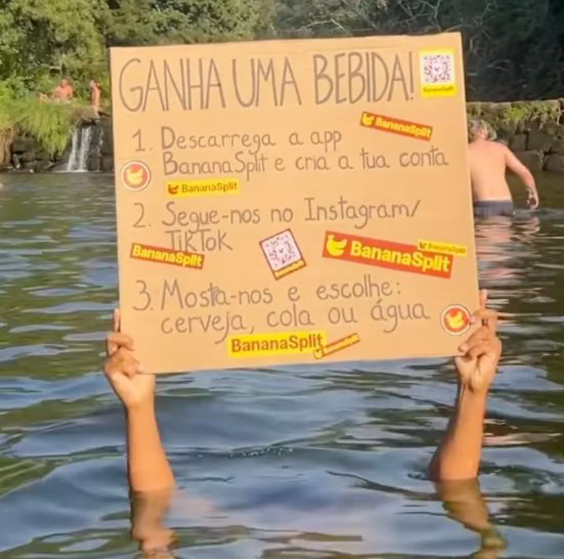 BananaSplit drinks activation sign held above the river at Paredes de Coura